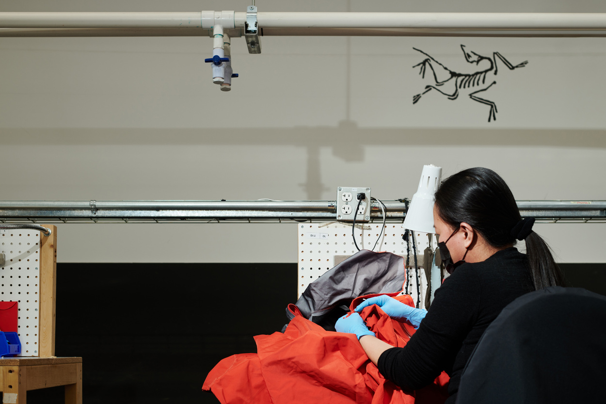 Shell jacket rework bench for waterproof outerwear quality control review
